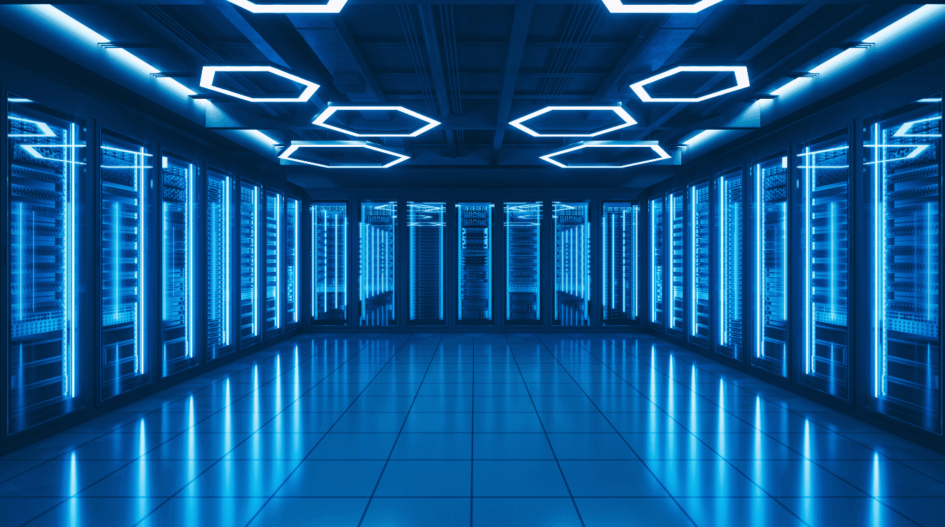 Blue-lit data centre with rows of server racks receding down an aisle