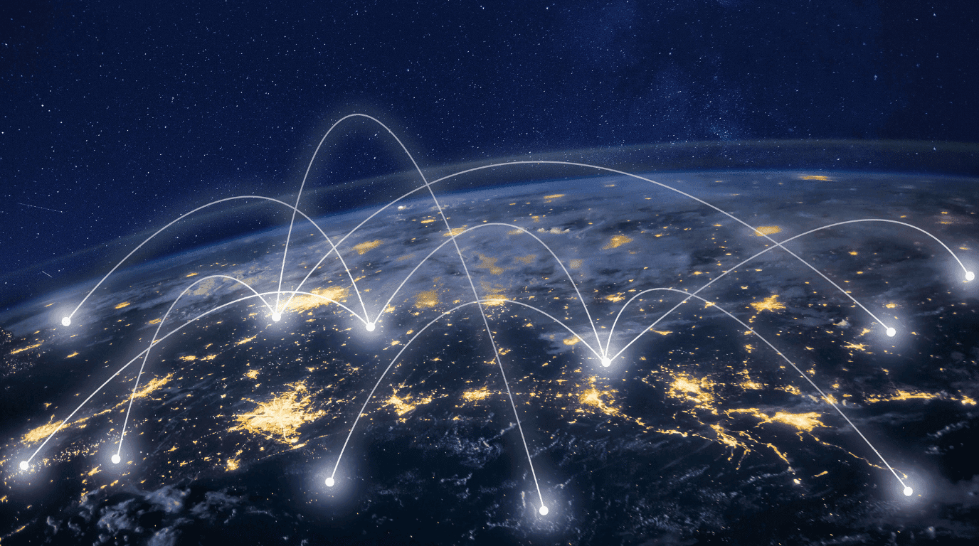 Points of light across a night-time Earth linked by arcing network connections
